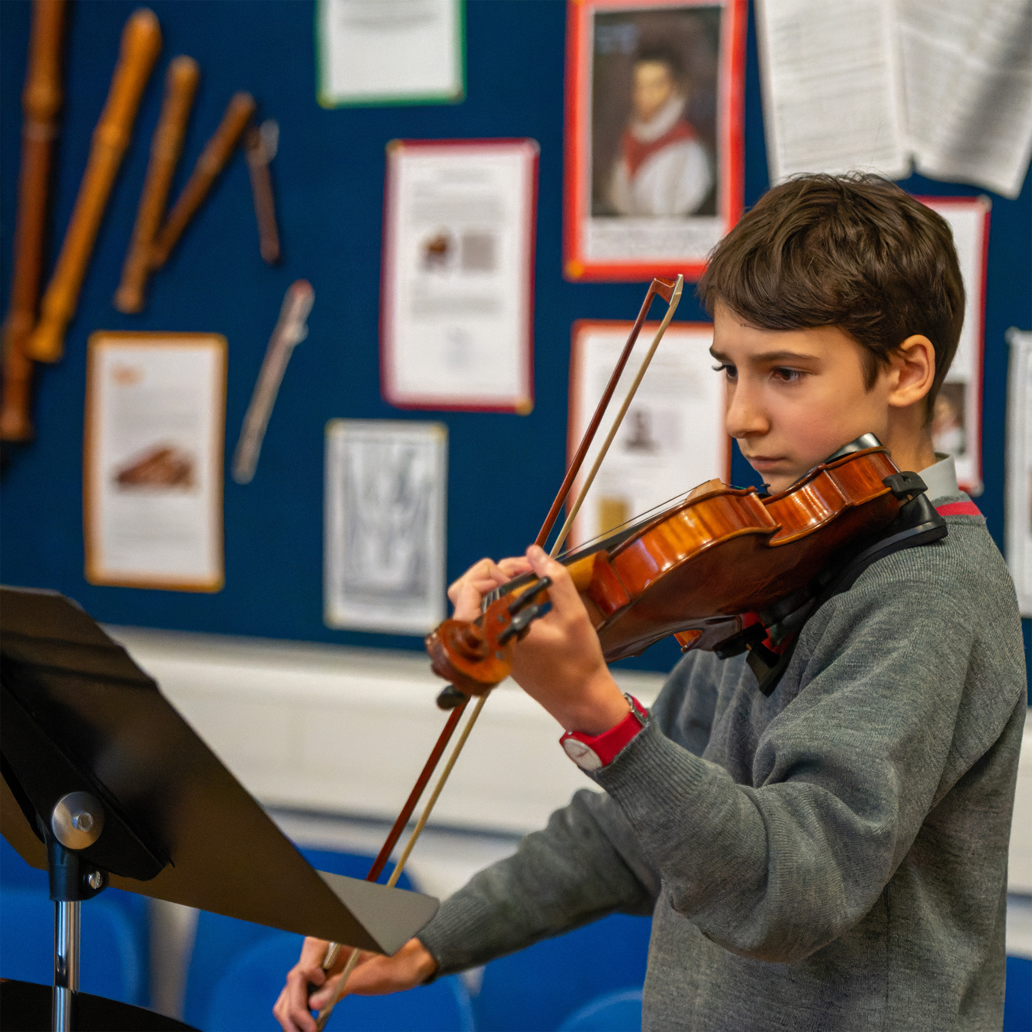 Pupil playing a violin