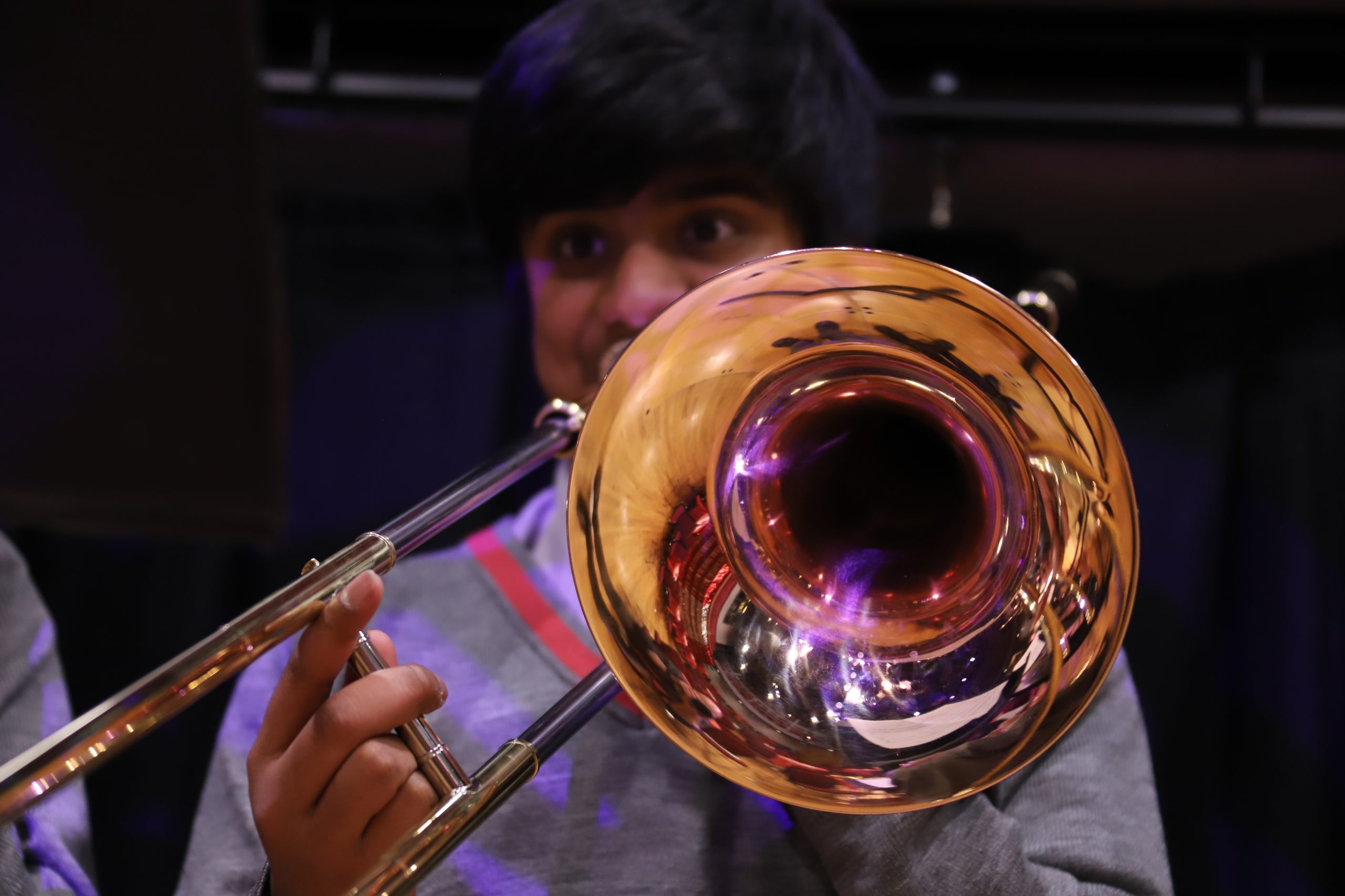Close up of pupil playing a trumpet